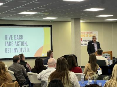 Andrew Konkel speak at the Champions of Change Luncheon